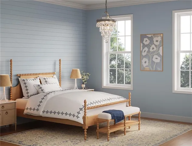 a bedroom with a bed and a couch