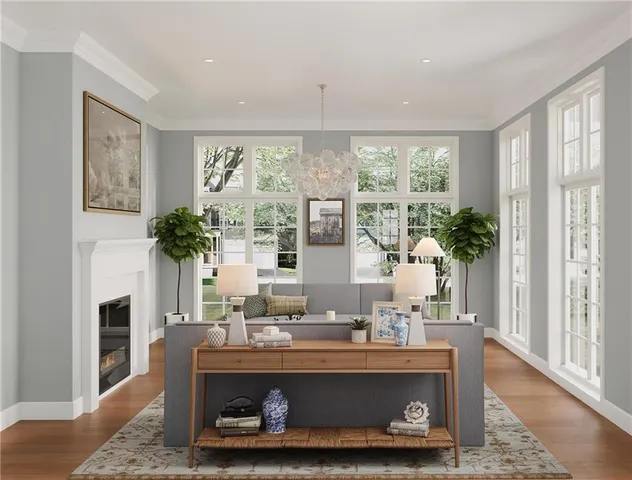 a view of living room with furniture and a potted plant