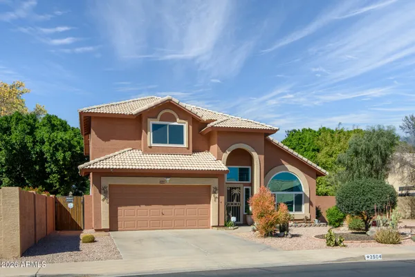 a front view of a house with a garage
