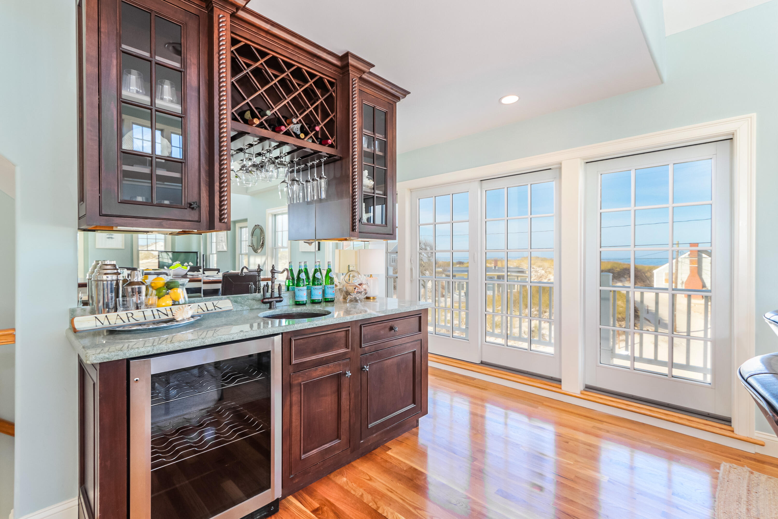 19 Dr Botero Road Dennis, MA 02638 - Photo 14 of 42 a open kitchen with granite countertop a stove a sink and a large window