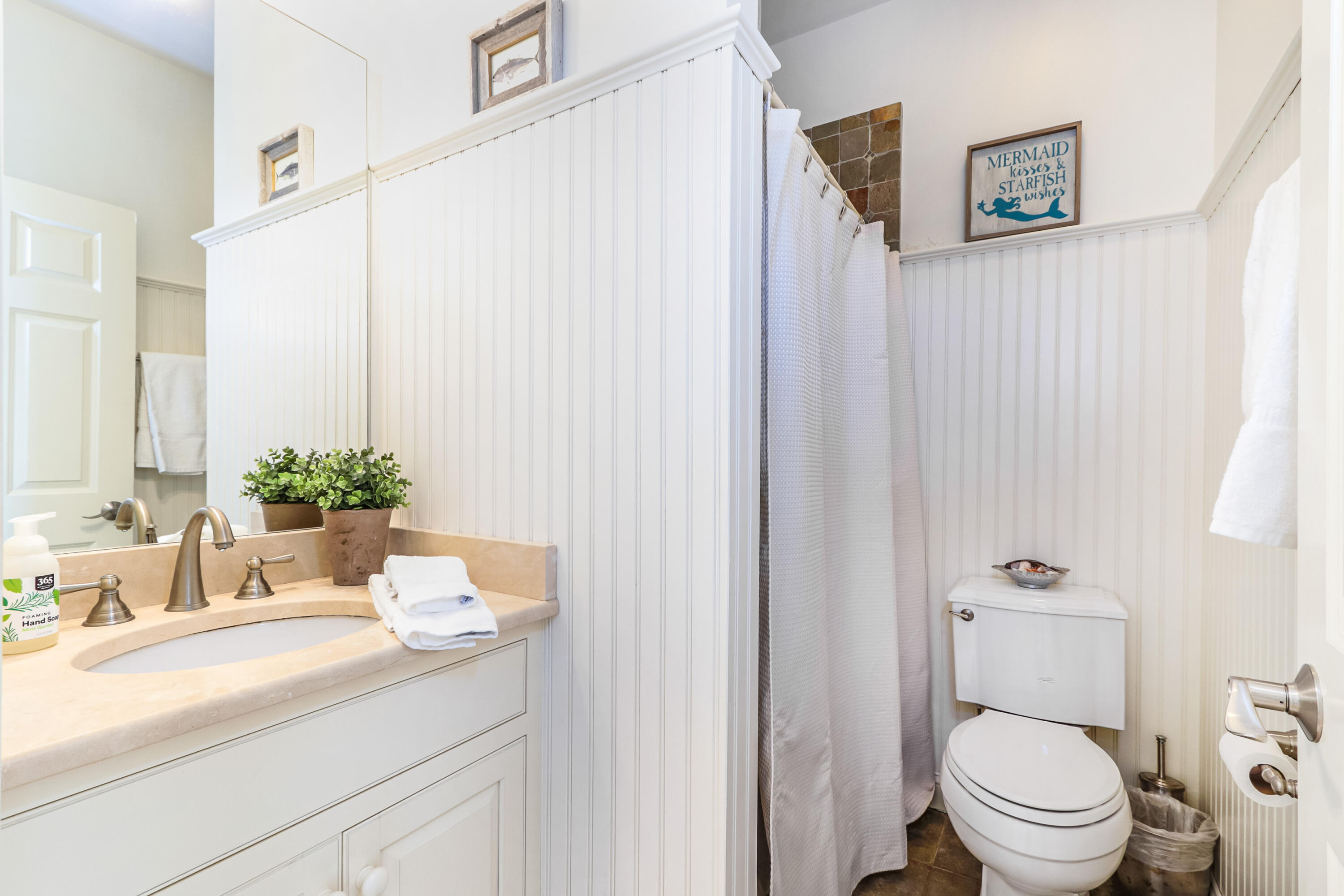 19 Dr Botero Road Dennis, MA 02638 - Photo 23 of 42 a bathroom with a granite countertop sink toilet and a mirror
