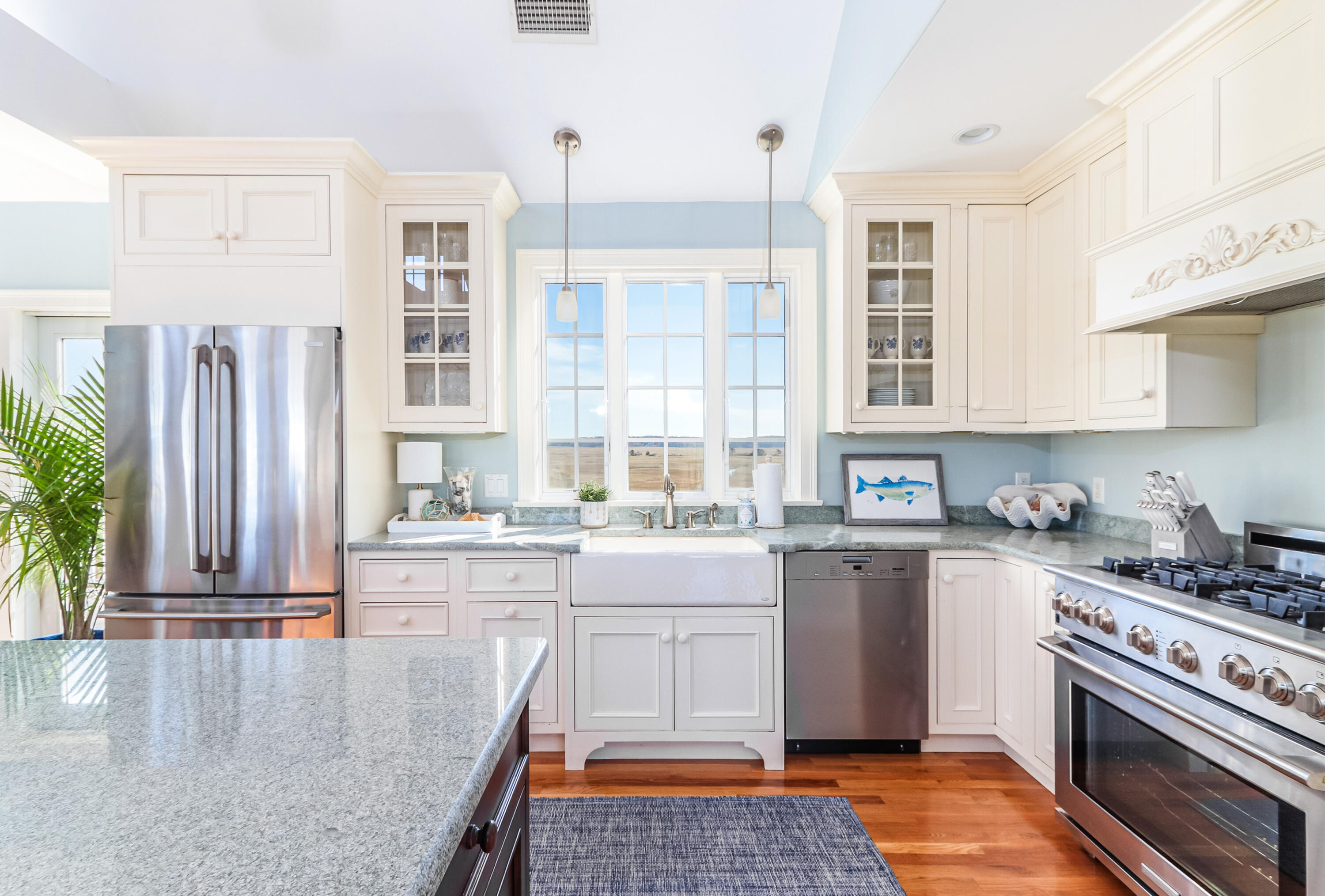 19 Dr Botero Road Dennis, MA 02638 - Photo 3 of 42 a kitchen with stainless steel appliances granite countertop a stove a sink and a refrigerator