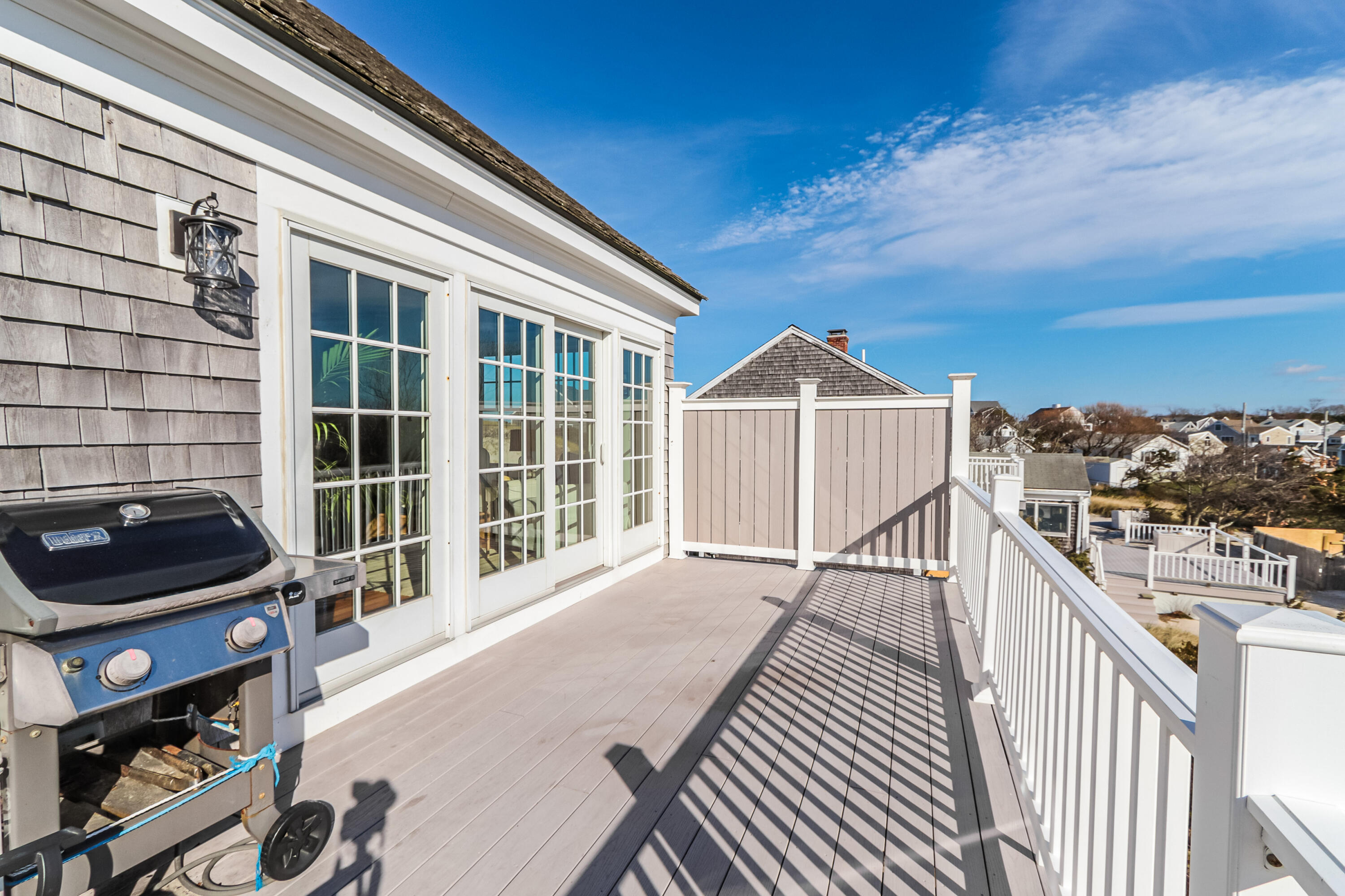19 Dr Botero Road Dennis, MA 02638 - Photo 37 of 42 a view of a balcony with wooden floor and city view