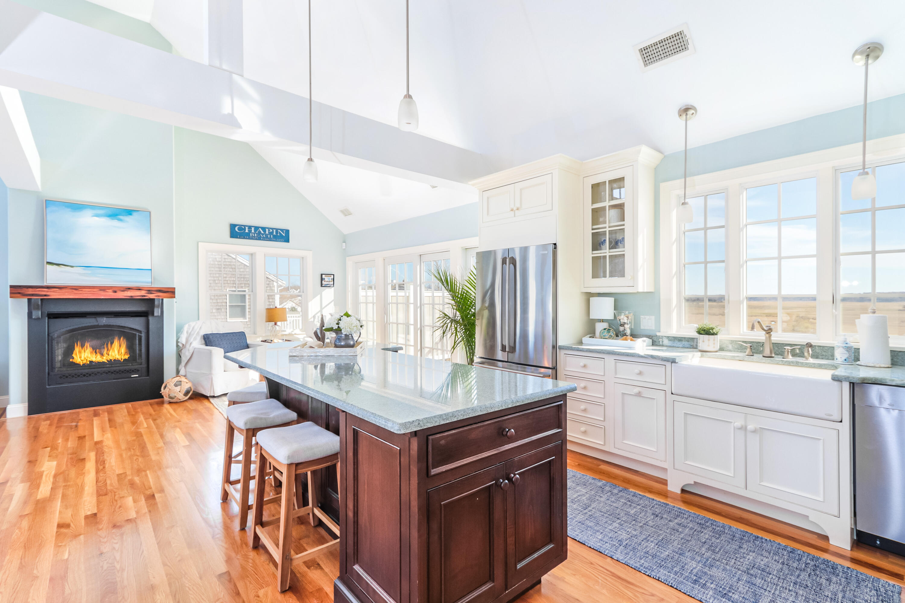 19 Dr Botero Road Dennis, MA 02638 - Photo 4 of 42 a kitchen with a stove a sink and a wooden cabinets