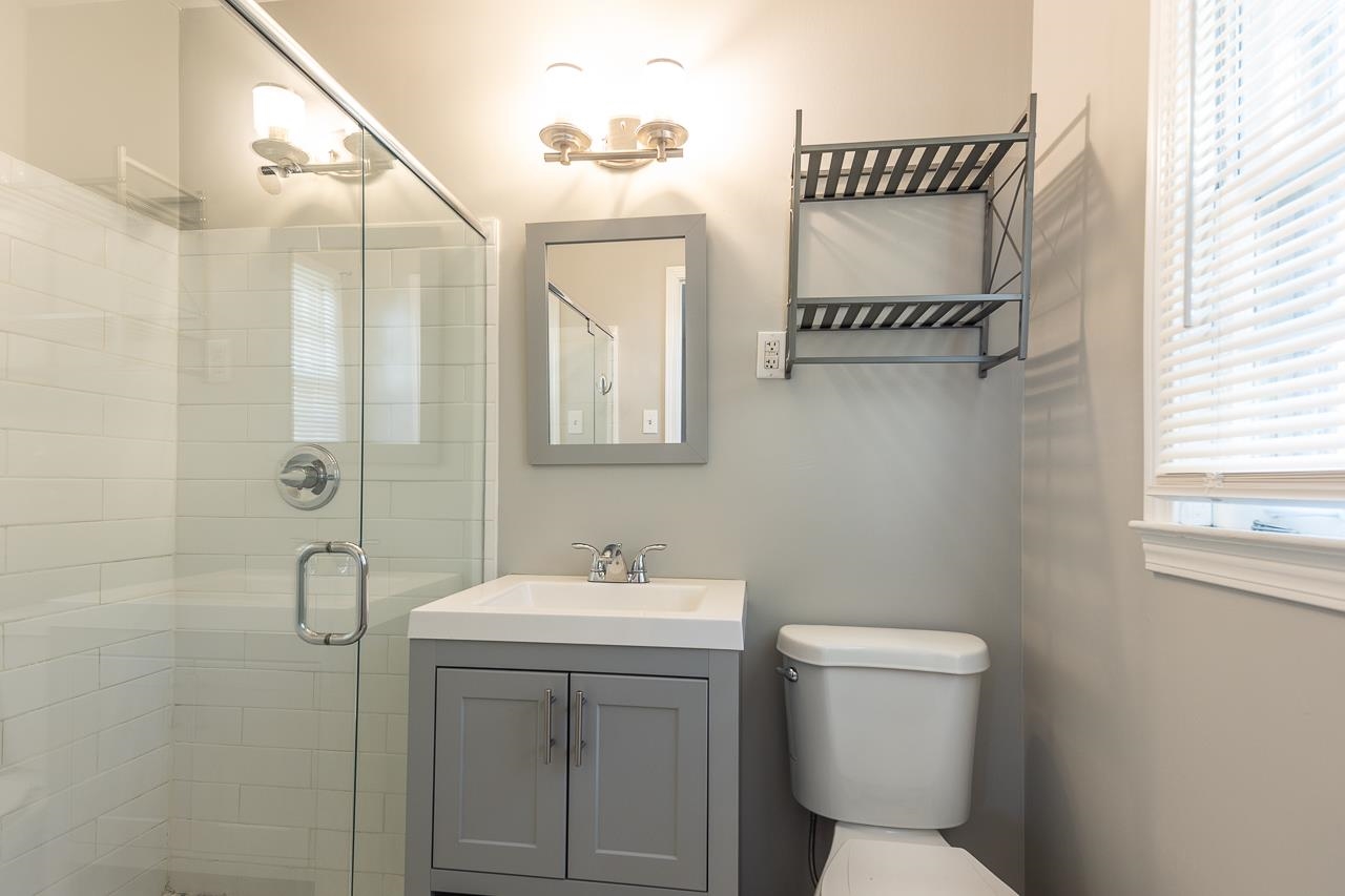 4606 Helene Road Memphis, TN 38117 - Photo 8 of 10 a bathroom with a toilet sink and mirror