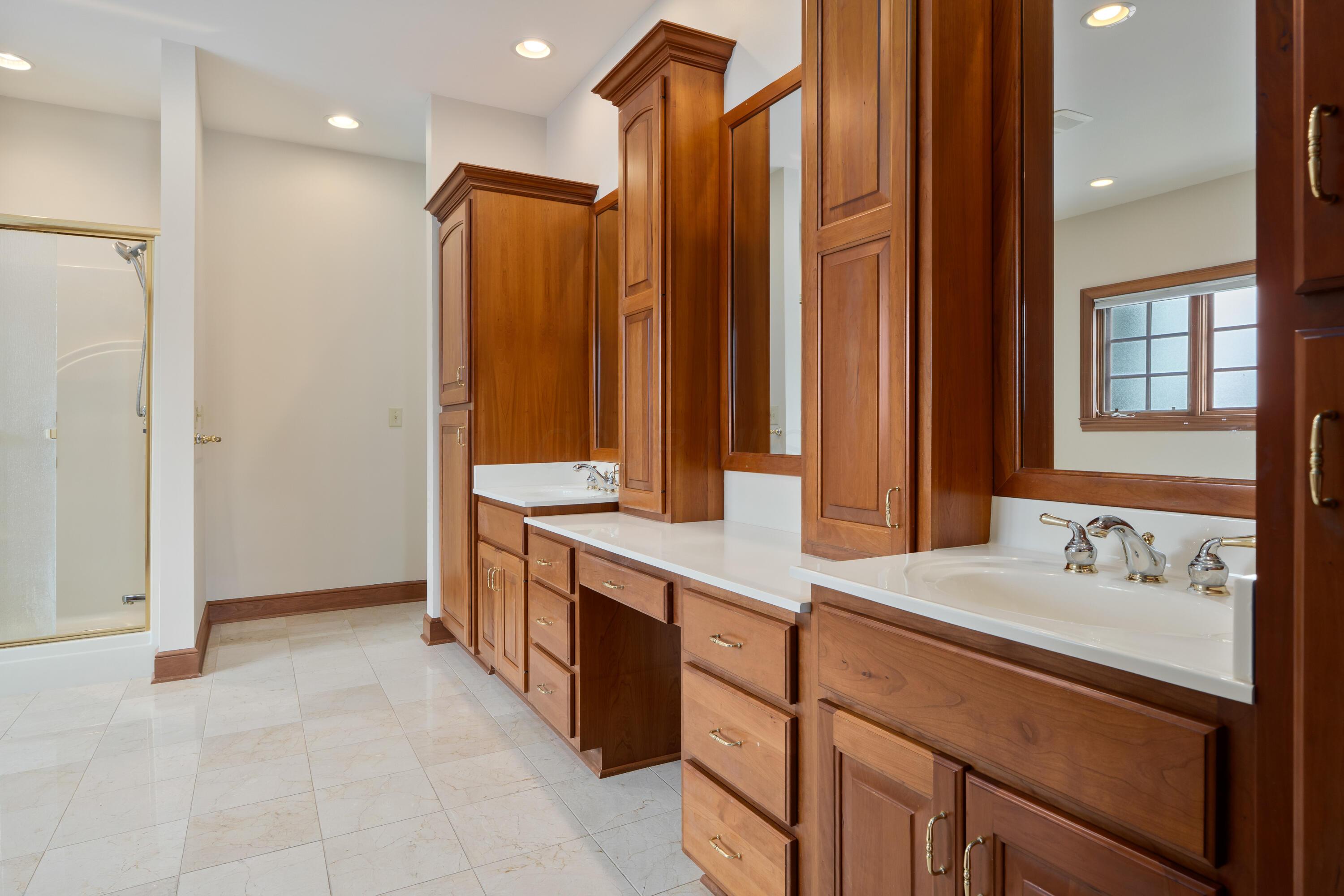 18261 Boerger Road Marysville, OH 43040 - Photo 40 of 94 Beautiful cabinetry and vanity layout- tons of storage. Shower and entry to closet shown in this pic