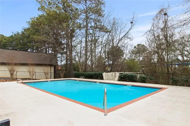 a view of a swimming pool with an outdoor space