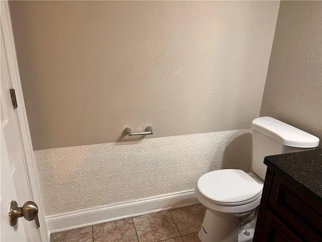 a bathroom with a toilet and a sink