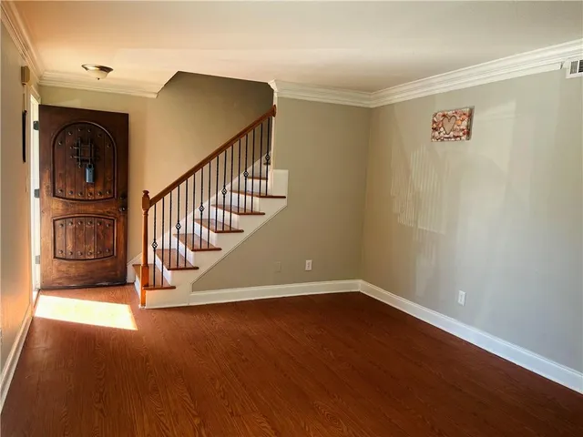 a view of entryway with wooden floor