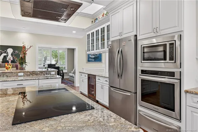 a bedroom with a large bed and a large window