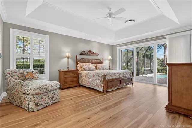 a bathroom with a granite countertop sink a mirror and a bathtub