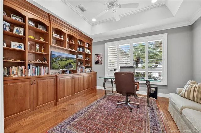 a bathroom with a granite countertop sink a toilet a mirror and shower