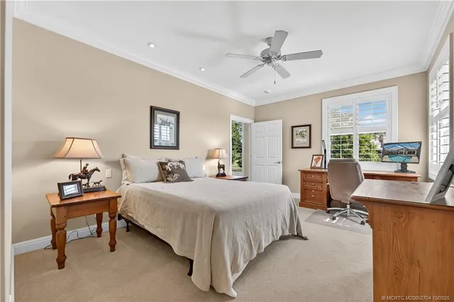 a bedroom with bed couch and window