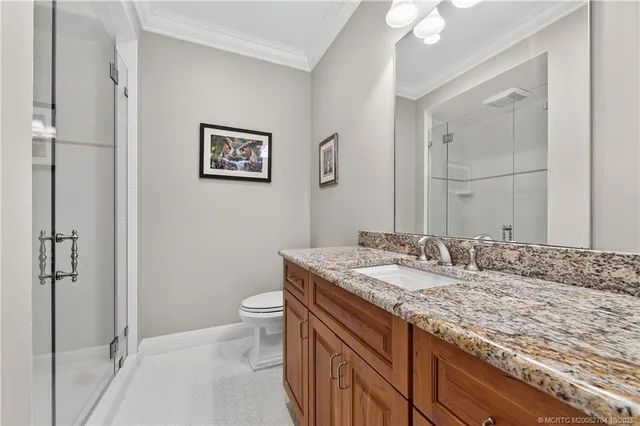 a utility room with cabinets washer and dryer