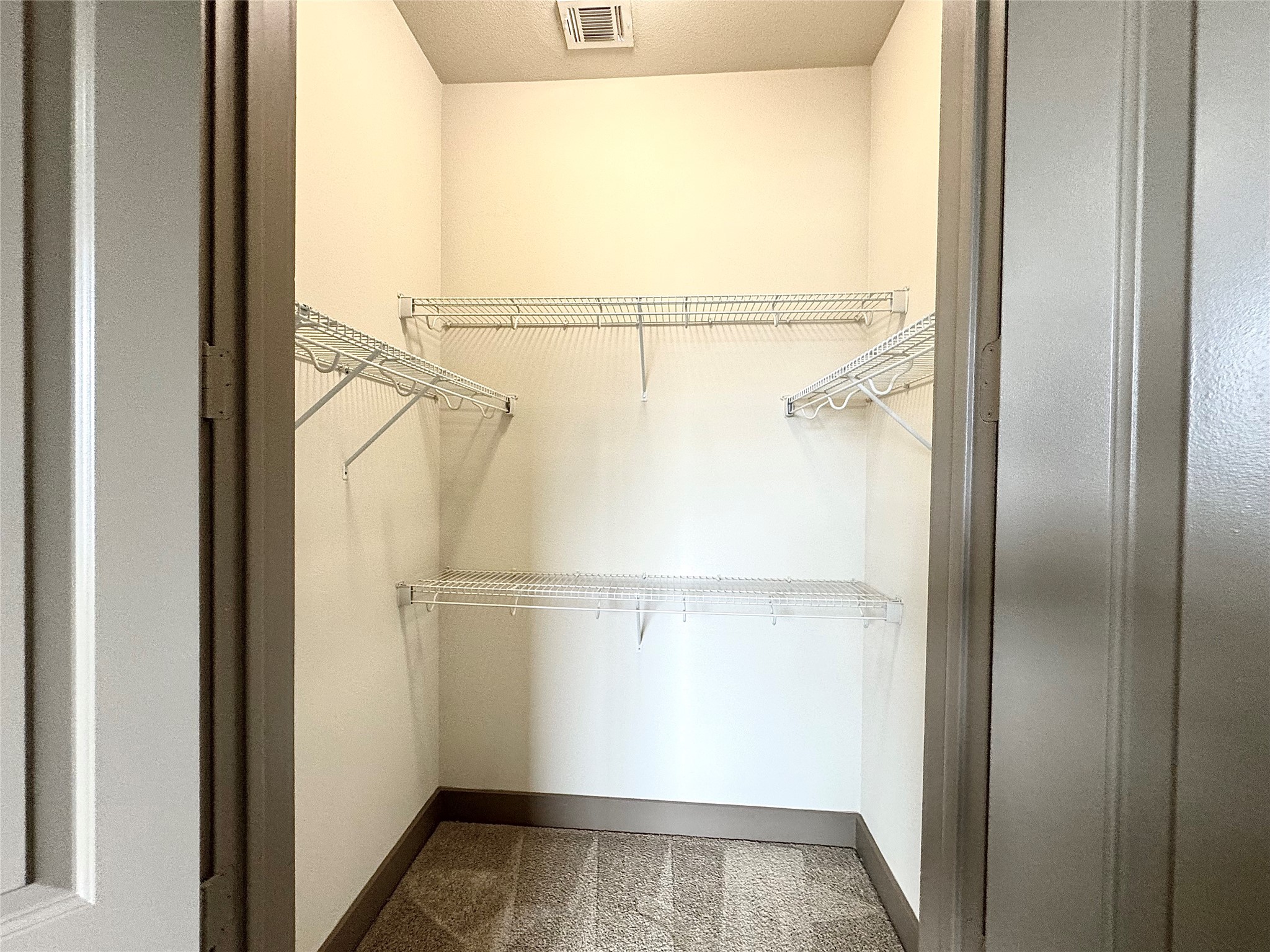 2033 South Gessner Road, Unit 2108 Houston, TX 77063 - Photo 11 of 21 a view of walk in closet with empty racks
