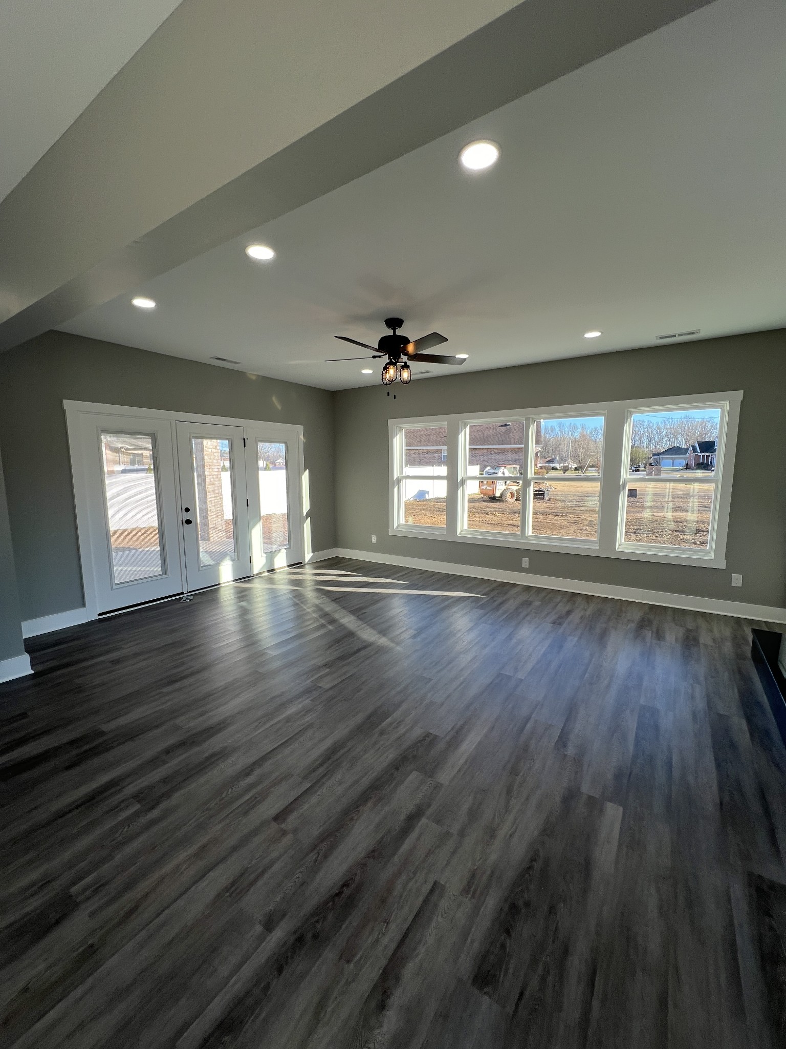 20 Post Road Manchester, TN 37355 - Photo 9 of 21 an empty room with wooden floor and windows