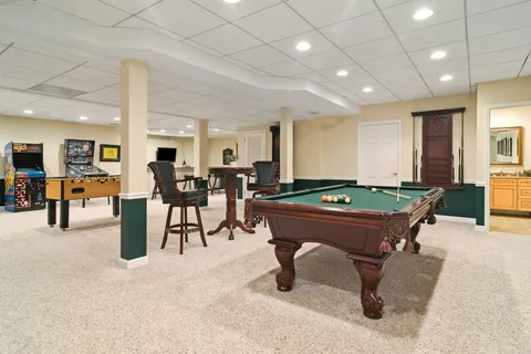 a room with lots of table chair and couches