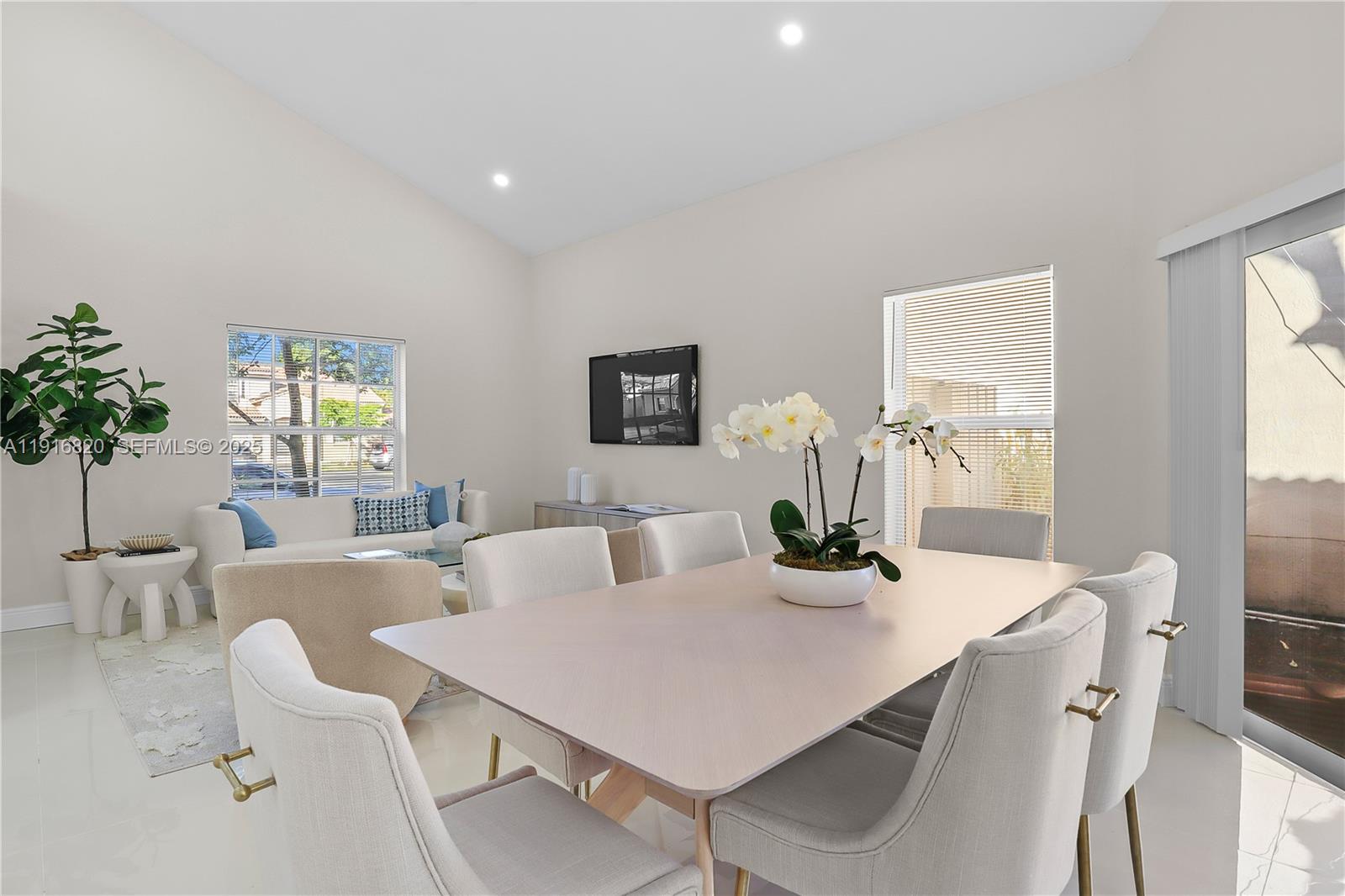 1223 Northwest 125th Terrace Sunrise, FL 33323 - Photo 12 of 89 a view of a dining room with furniture and window