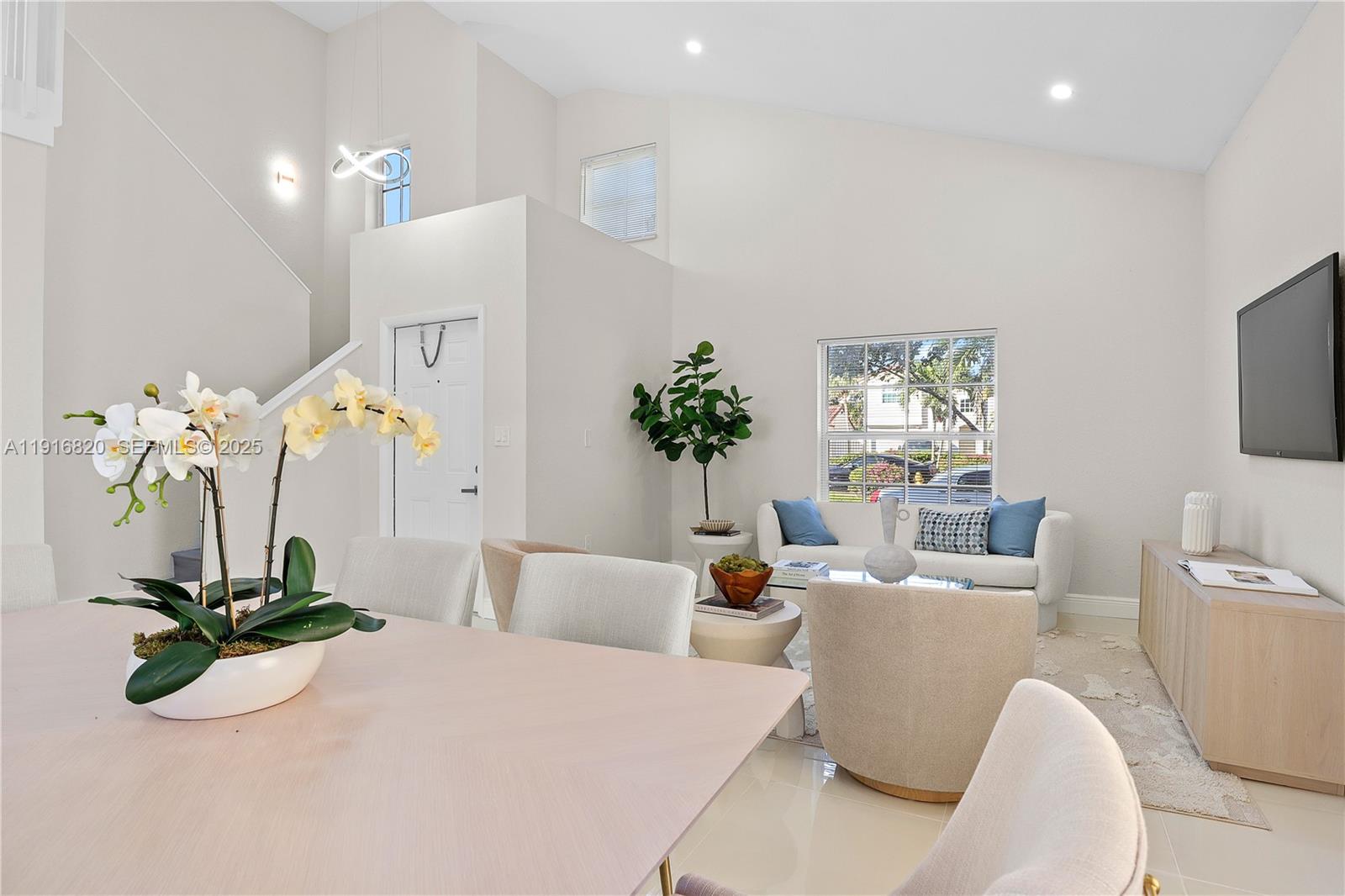 1223 Northwest 125th Terrace Sunrise, FL 33323 - Photo 13 of 89 a living room with furniture potted plant and a mirror