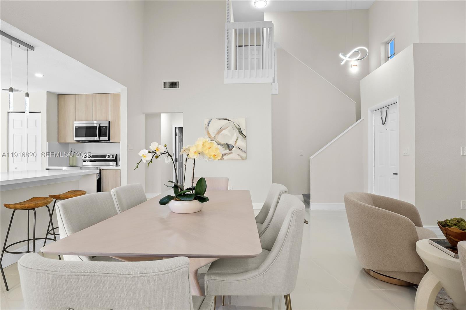 1223 Northwest 125th Terrace Sunrise, FL 33323 - Photo 14 of 89 a dining room with furniture and wooden floor