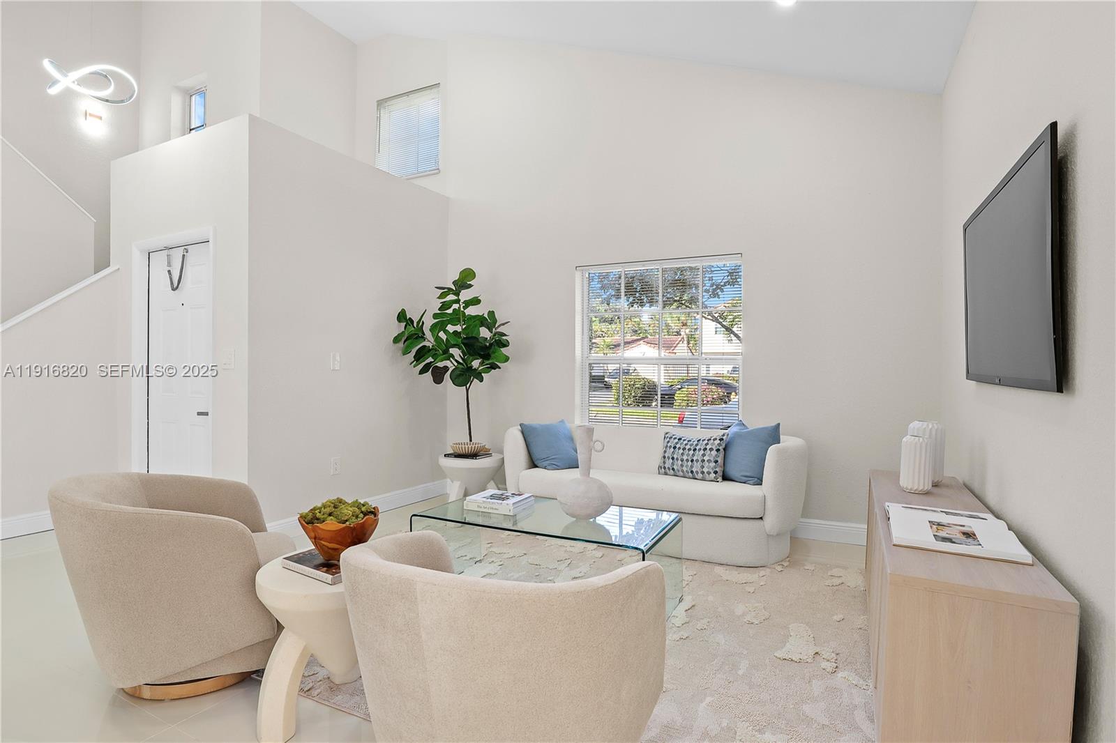 1223 Northwest 125th Terrace Sunrise, FL 33323 - Photo 15 of 89 a living room with furniture and a potted plant