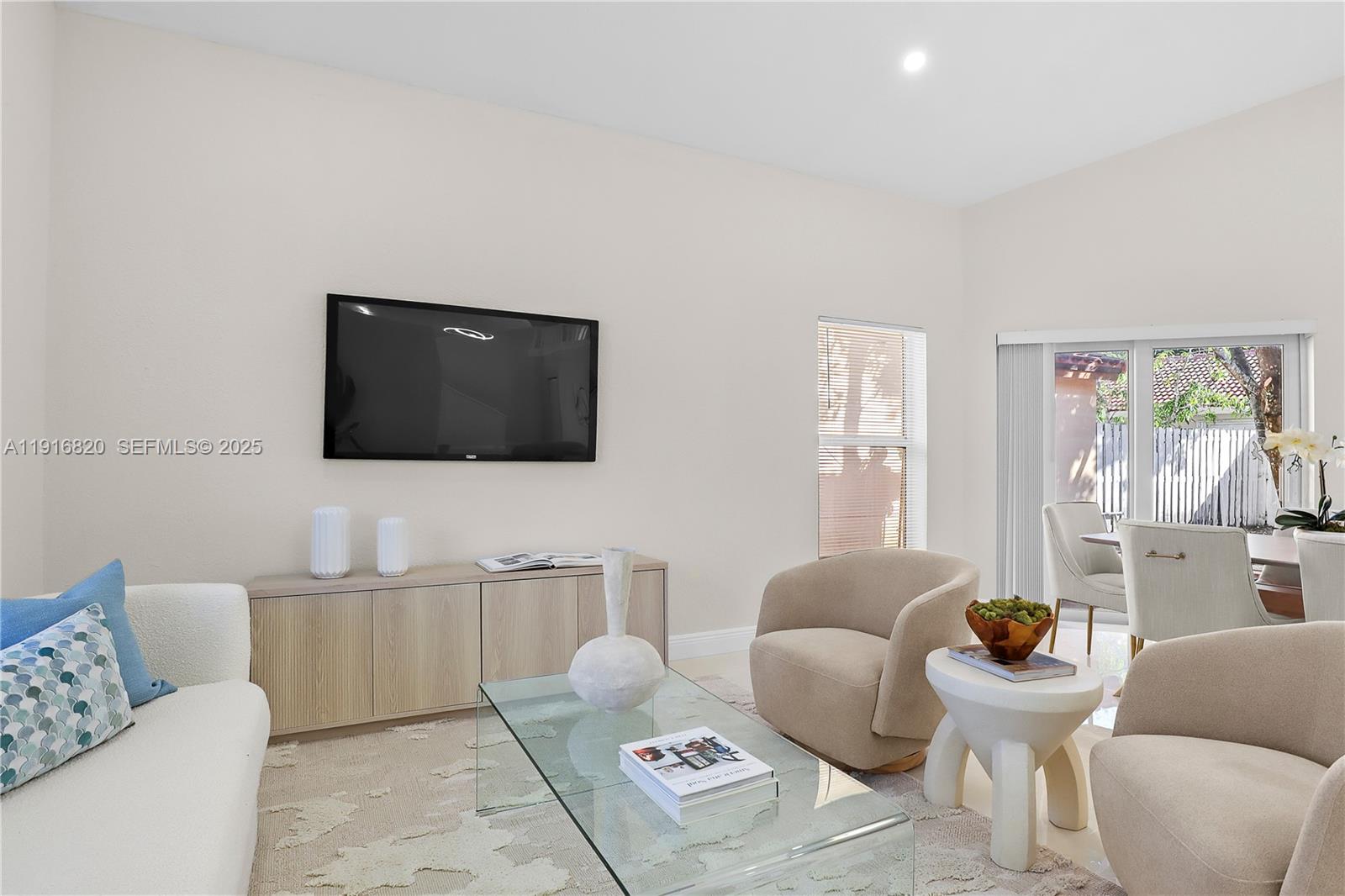 1223 Northwest 125th Terrace Sunrise, FL 33323 - Photo 20 of 89 a living room with furniture and a flat screen tv