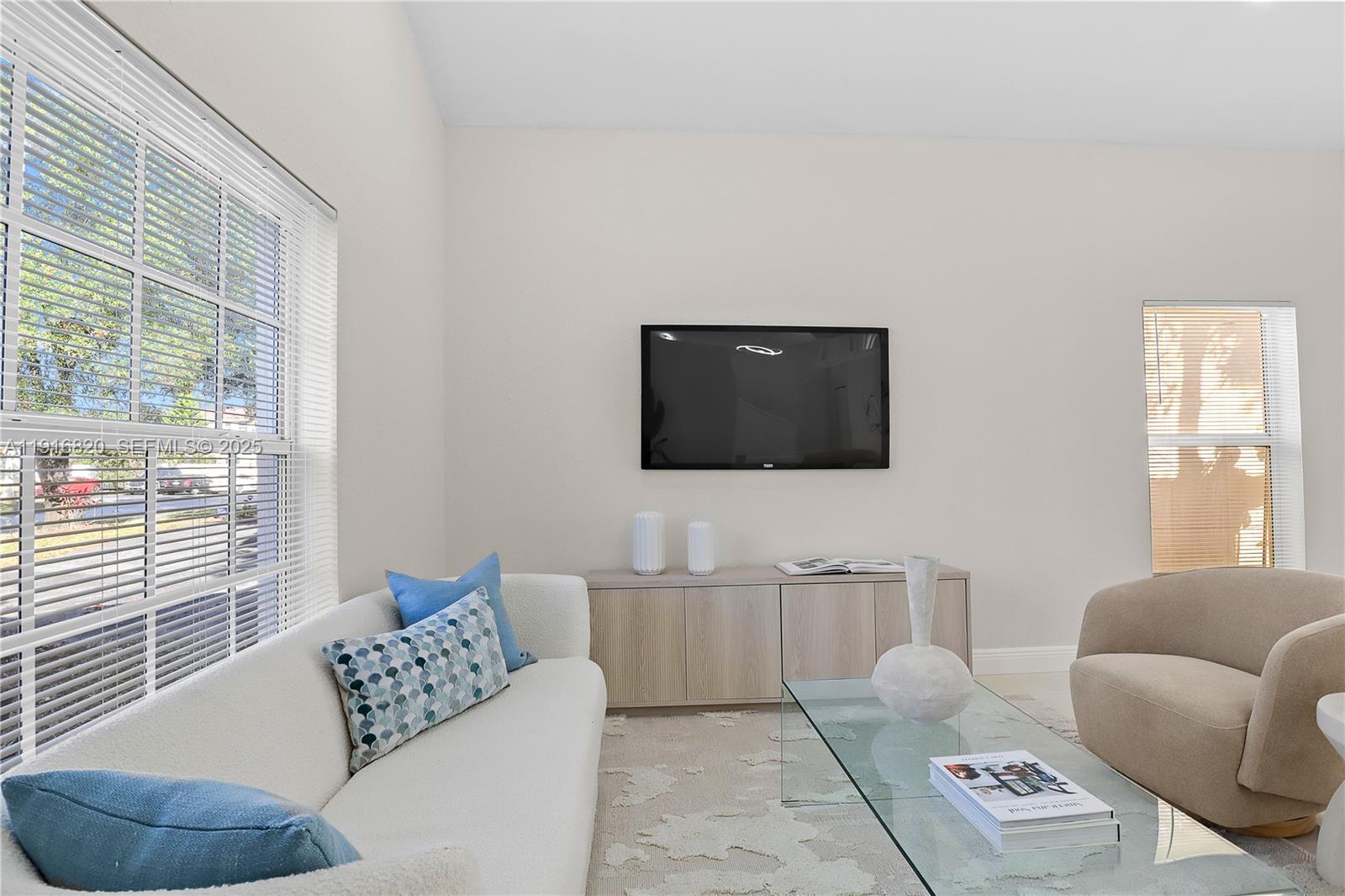 1223 Northwest 125th Terrace Sunrise, FL 33323 - Photo 21 of 89 a living room with furniture and a flat screen tv