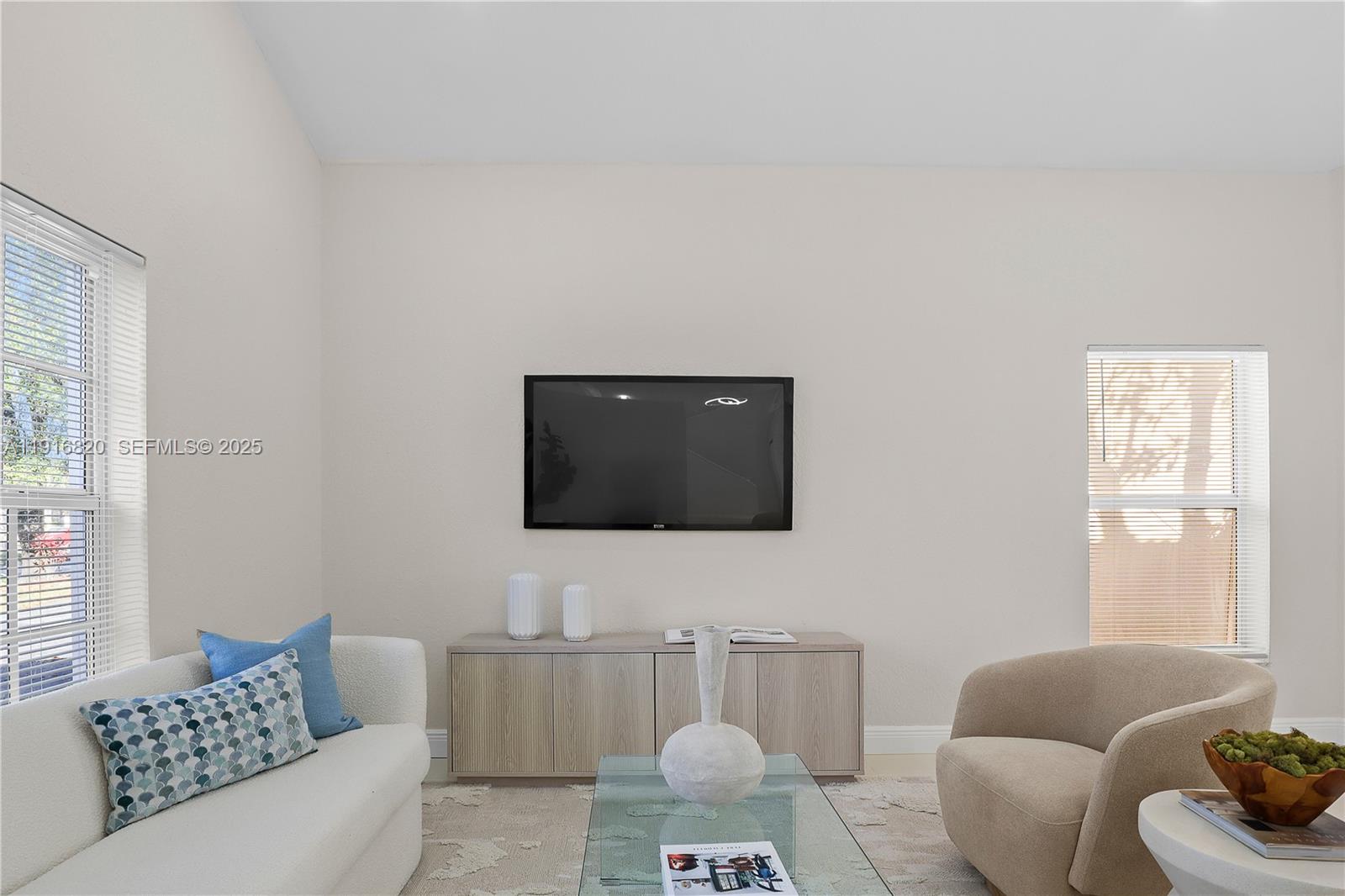 1223 Northwest 125th Terrace Sunrise, FL 33323 - Photo 22 of 89 a living room with furniture and a flat screen tv