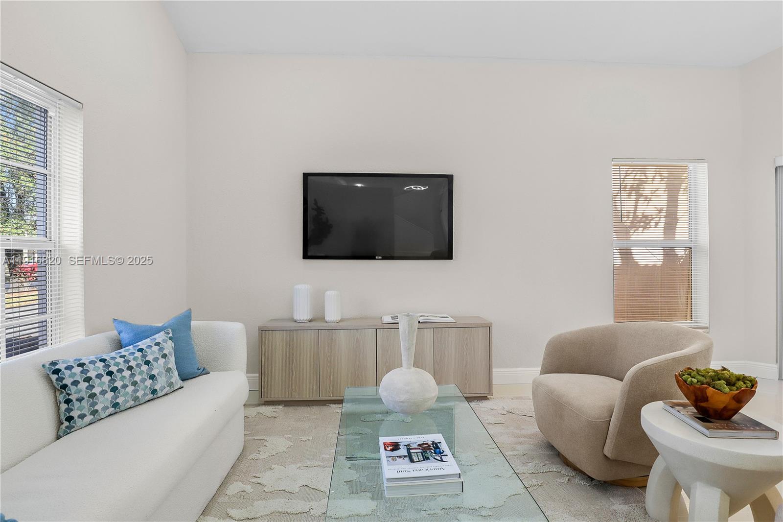 1223 Northwest 125th Terrace Sunrise, FL 33323 - Photo 23 of 89 a living room with furniture and a flat screen tv