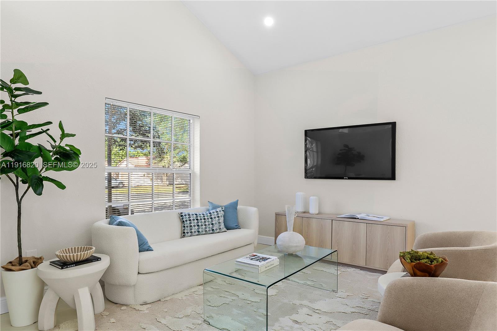 1223 Northwest 125th Terrace Sunrise, FL 33323 - Photo 25 of 89 a living room with furniture and a potted plant