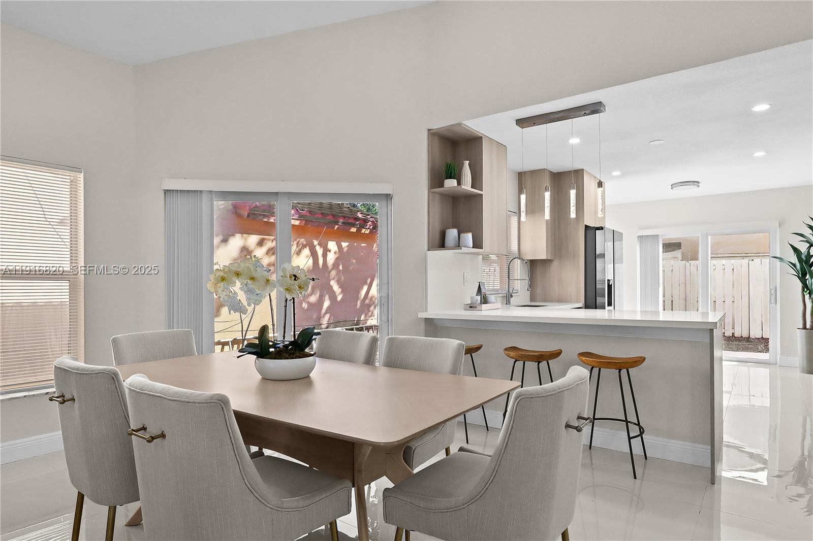 1223 Northwest 125th Terrace Sunrise, FL 33323 - Photo 26 of 89 a view of a dining room with furniture and window