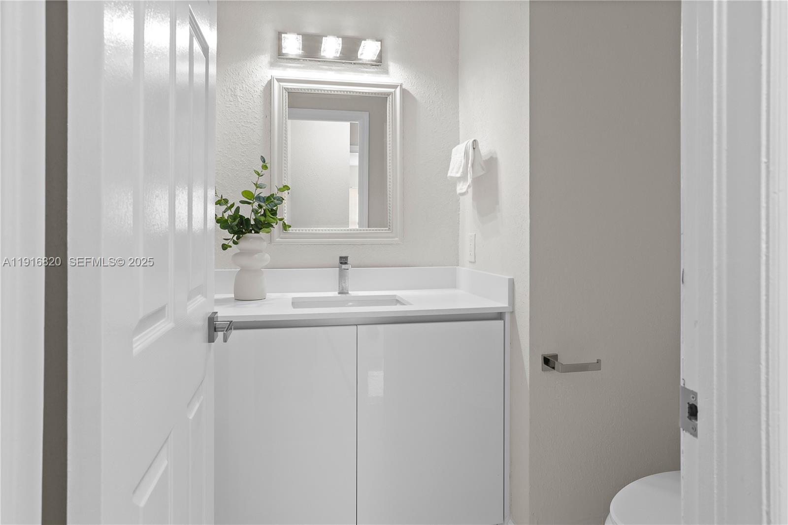 1223 Northwest 125th Terrace Sunrise, FL 33323 - Photo 37 of 89 a bathroom with a sink vanity granite and toilet