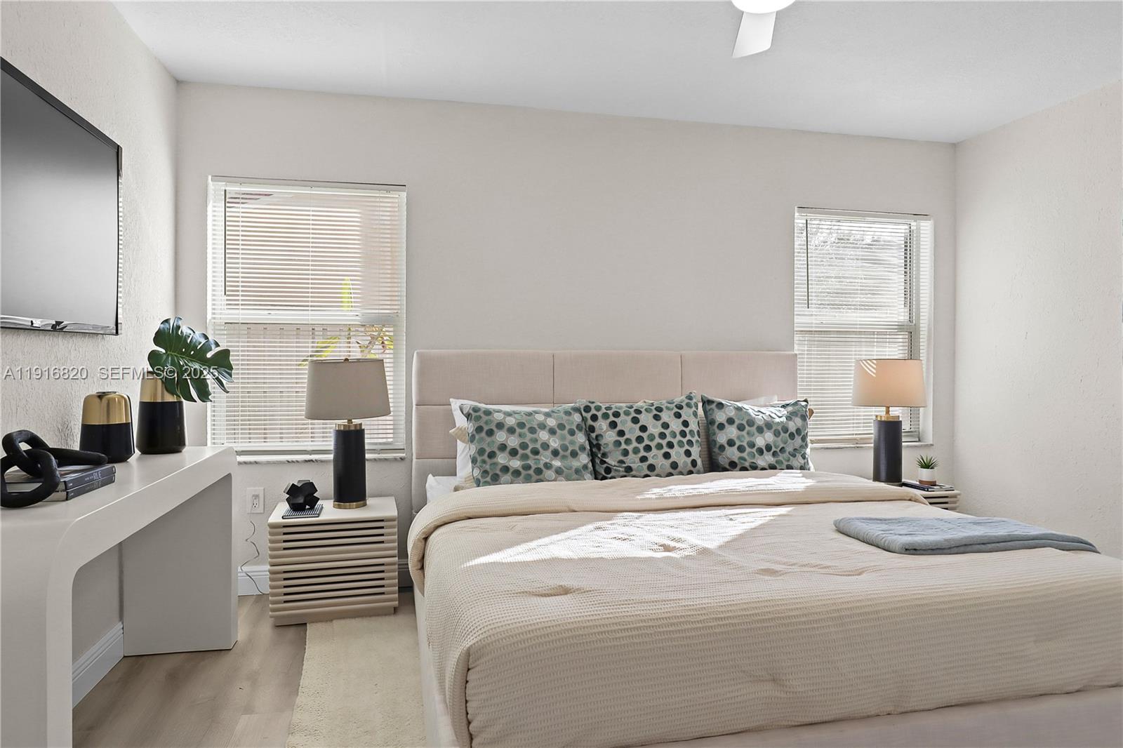 1223 Northwest 125th Terrace Sunrise, FL 33323 - Photo 41 of 89 a bedroom with a large bed and a window