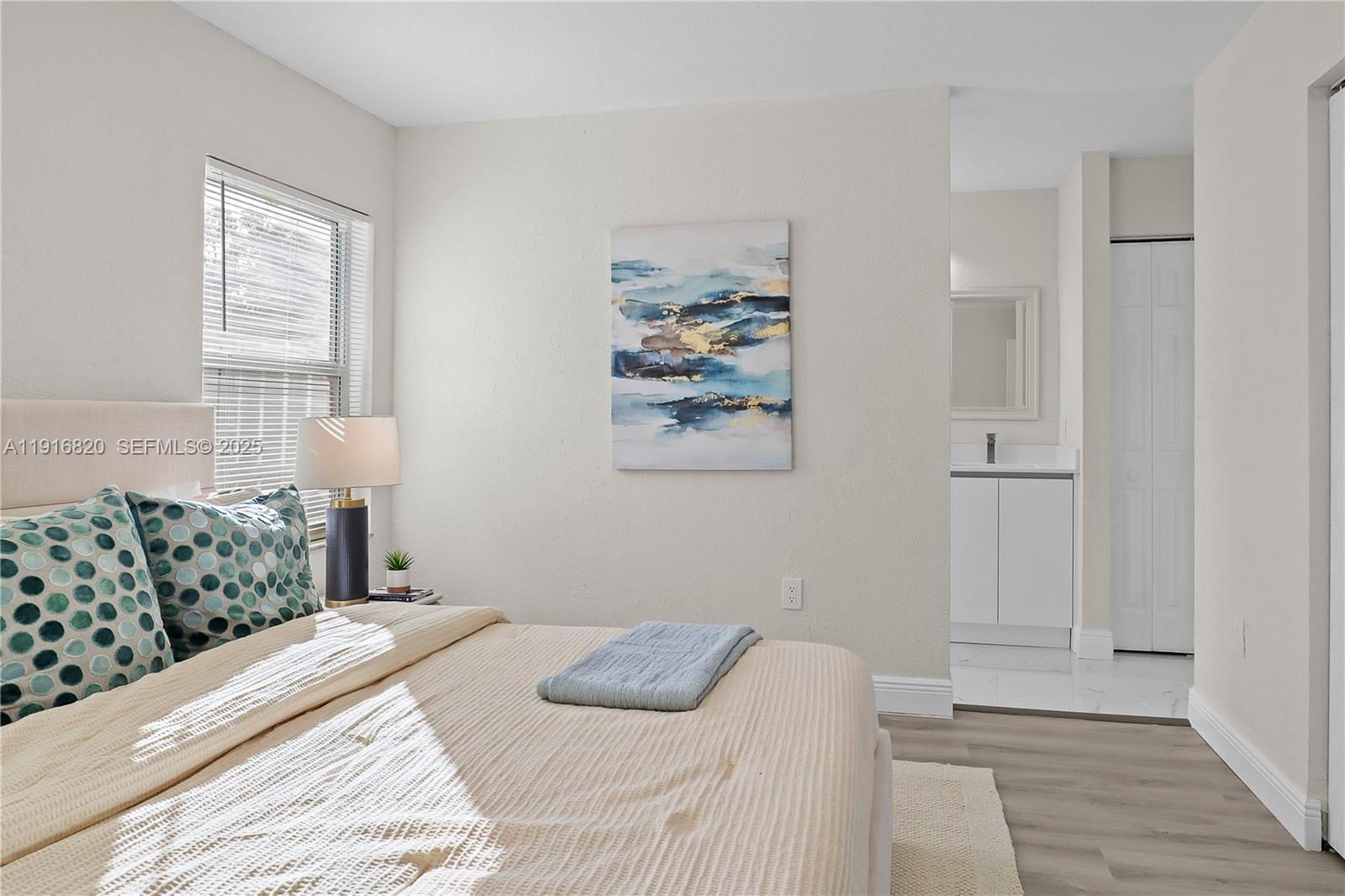 1223 Northwest 125th Terrace Sunrise, FL 33323 - Photo 43 of 89 a bedroom with a bed and a window