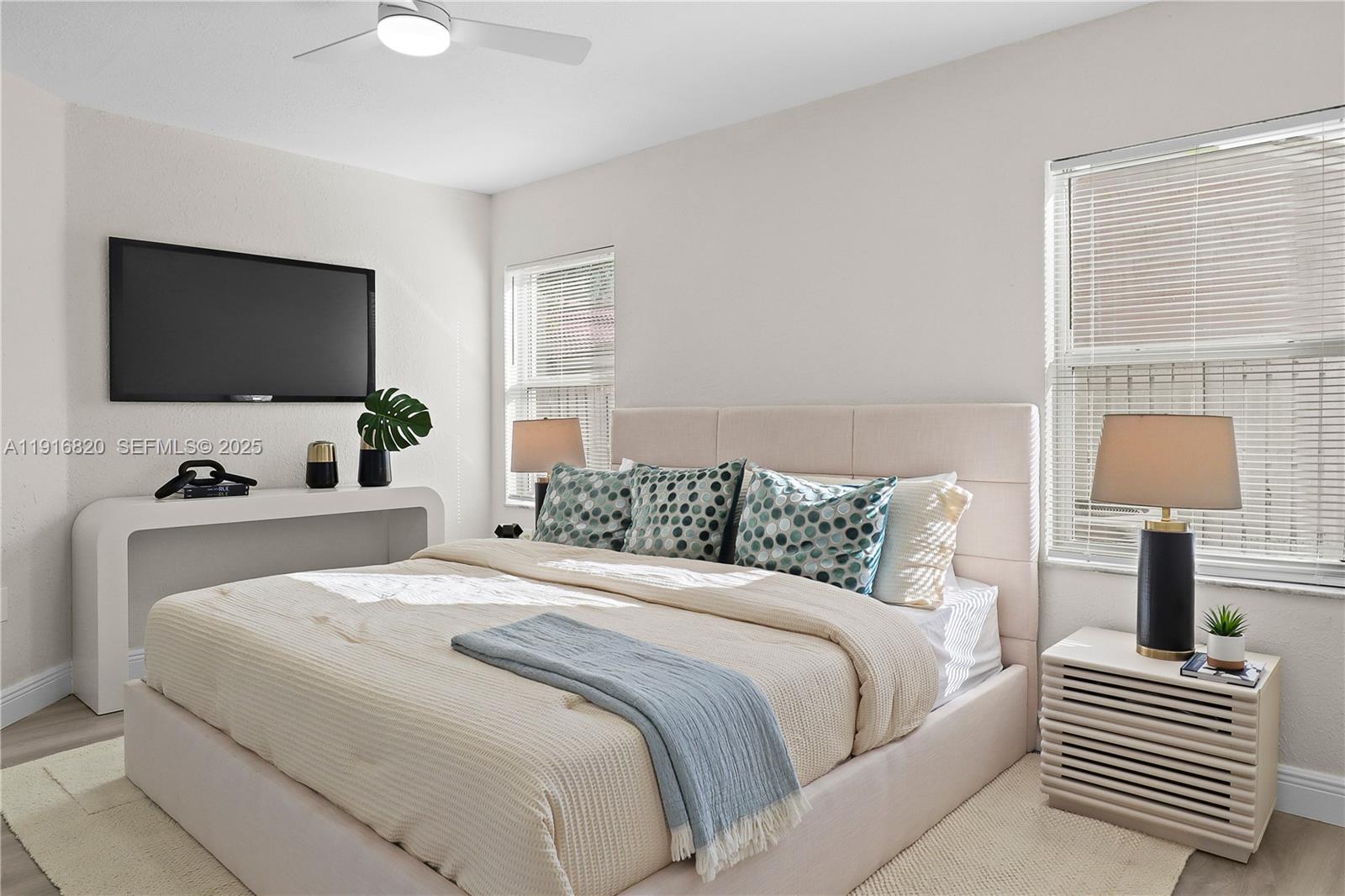 1223 Northwest 125th Terrace Sunrise, FL 33323 - Photo 44 of 89 a bedroom with a bed and a flat screen tv