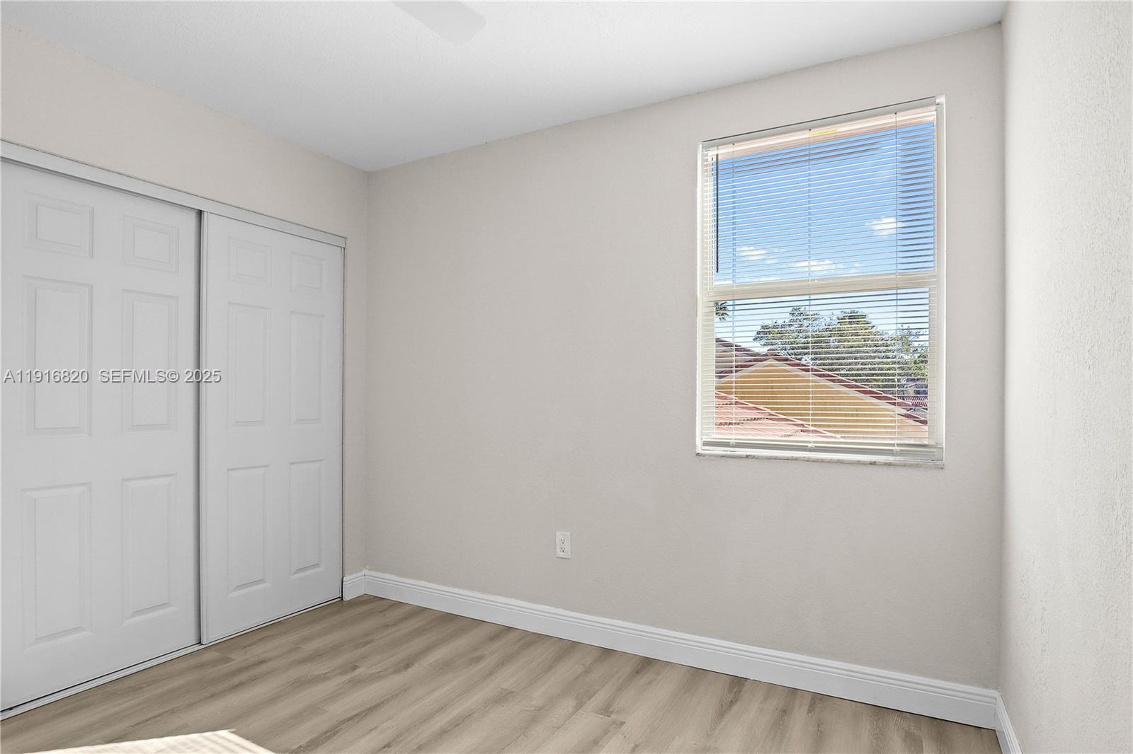 1223 Northwest 125th Terrace Sunrise, FL 33323 - Photo 58 of 89 an empty room with window