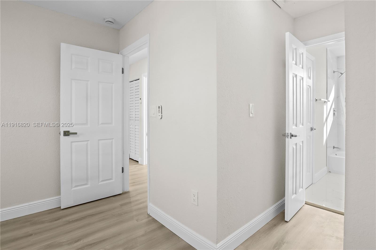 1223 Northwest 125th Terrace Sunrise, FL 33323 - Photo 66 of 89 a view of a hallway with wooden floor