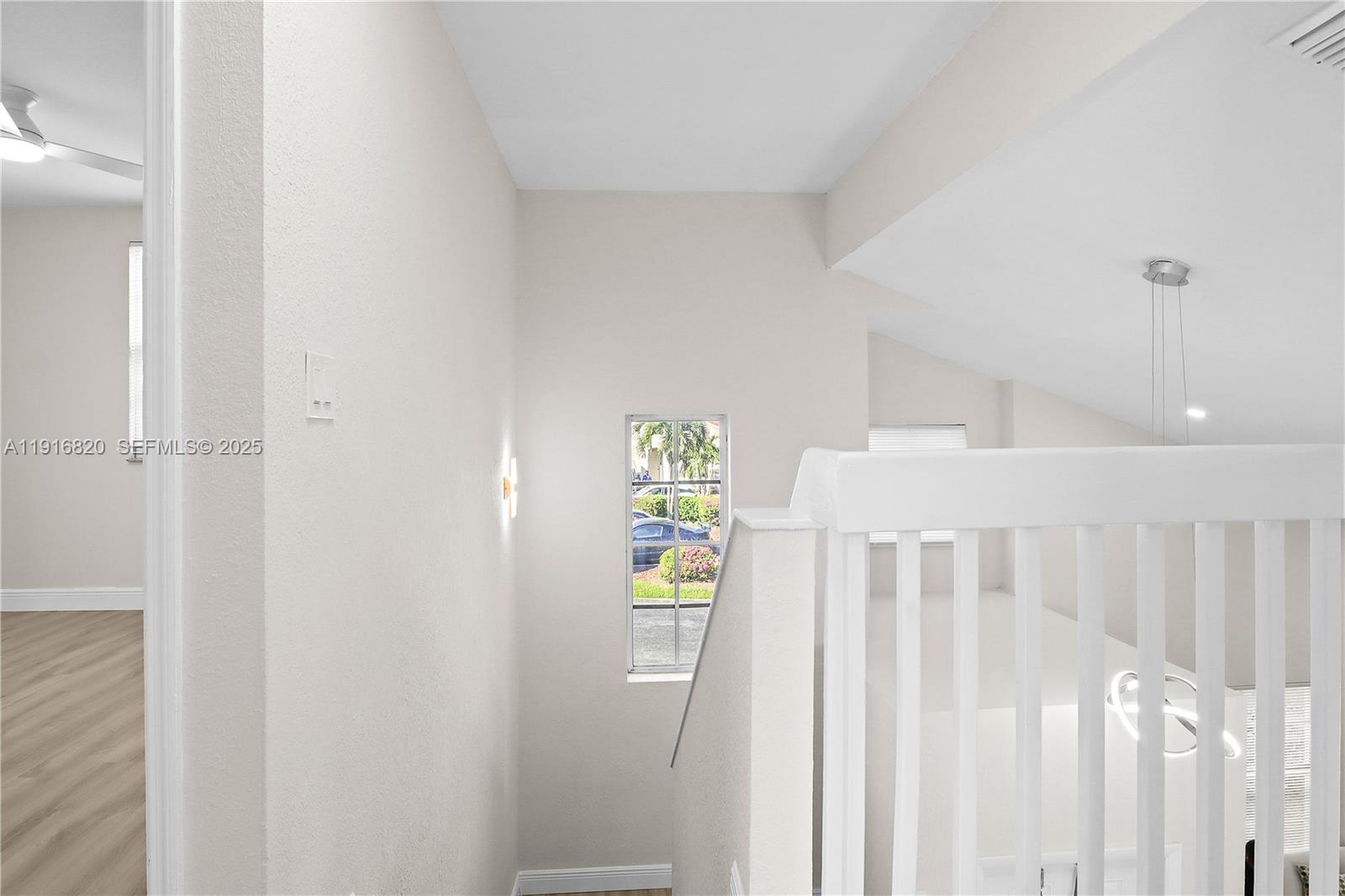 1223 Northwest 125th Terrace Sunrise, FL 33323 - Photo 72 of 89 a view of an entryway with wooden floor