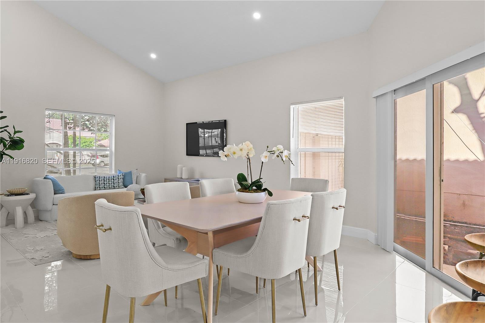 1223 Northwest 125th Terrace Sunrise, FL 33323 - Photo 77 of 89 a view of a dining room with furniture a livingroom and wooden floor