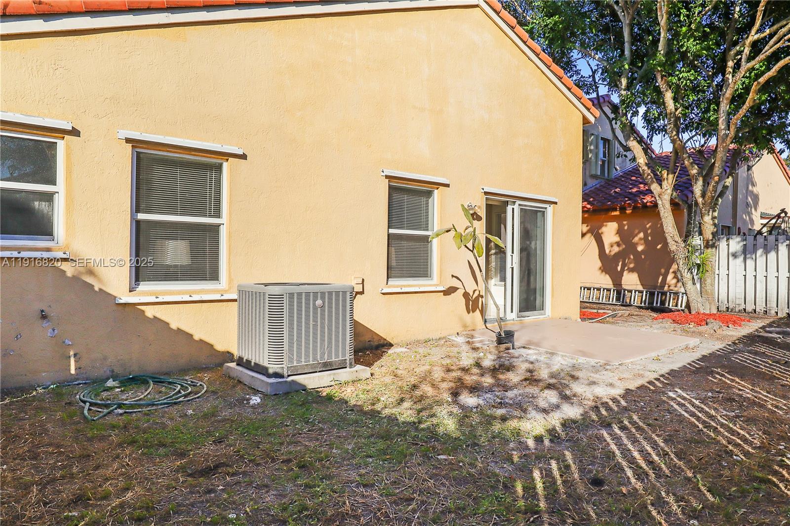 1223 Northwest 125th Terrace Sunrise, FL 33323 - Photo 80 of 89 a view of a house with a yard and garage