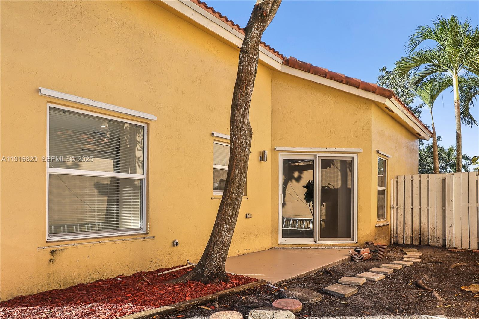 1223 Northwest 125th Terrace Sunrise, FL 33323 - Photo 84 of 89 a front view of a house with a yard