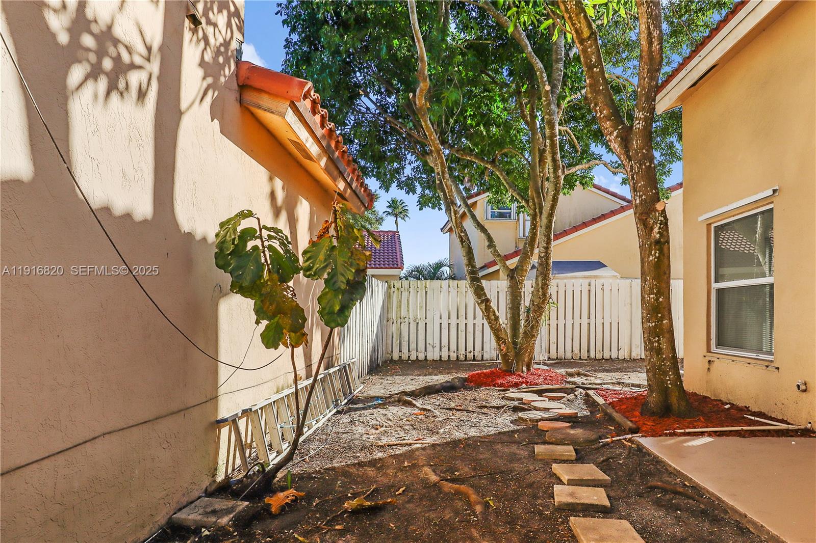 1223 Northwest 125th Terrace Sunrise, FL 33323 - Photo 86 of 89 a front view of a house with a tree