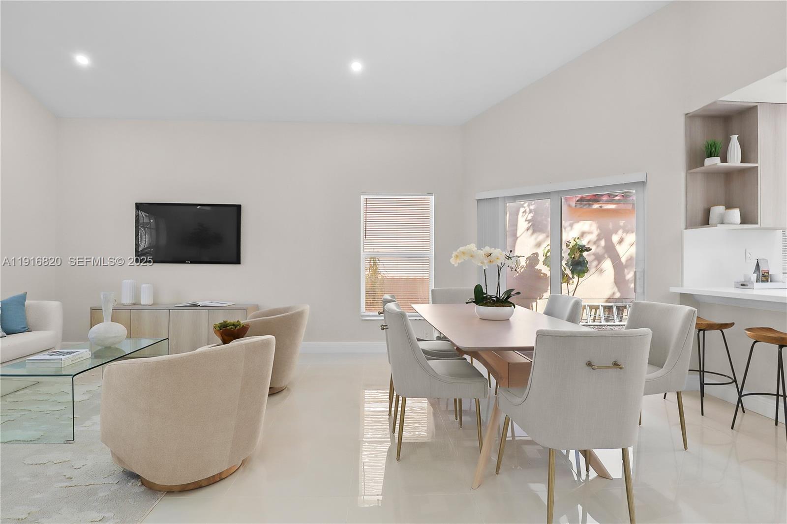 1223 Northwest 125th Terrace Sunrise, FL 33323 - Photo 9 of 89 a view of a dining room with furniture and wooden floor