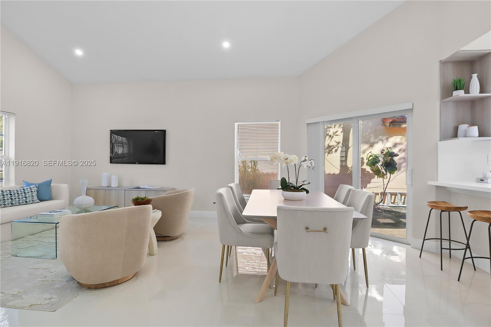 1223 Northwest 125th Terrace Sunrise, FL 33323 - Photo 10 of 89 a living room with furniture and a flat screen tv
