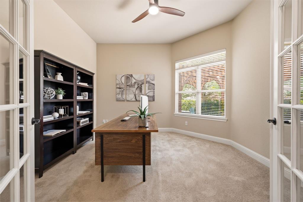 7013 Handel Colleyville, TX 76034 - Photo 11 of 37 Office space featuring double French doors, a ceiling fan, a large window with blinds, and neutral carpet flooring