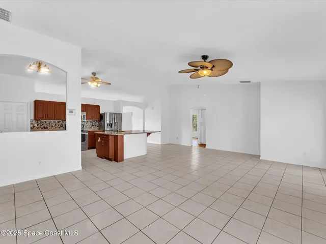 a kitchen with stainless steel appliances granite countertop a sink and a stove