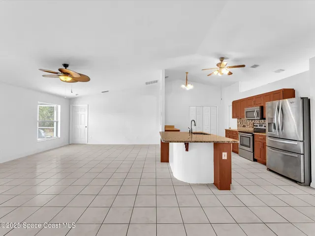 a bed room with a bed and a chandelier