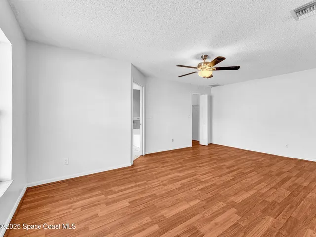 a view of a backyard with a swimming pool