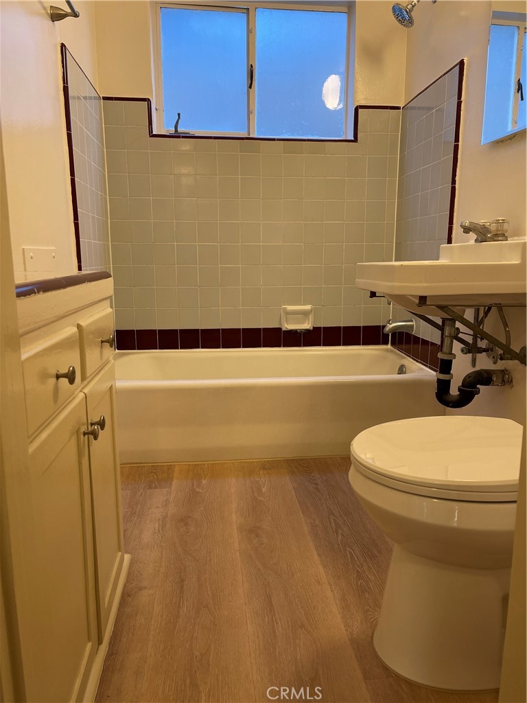 970 Elden Avenue, Unit 3 Los Angeles, CA 90006 - Photo 8 of 10 a bathroom with a toilet and a sink