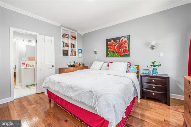 a bed room with a bed and a chair